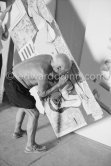 Pablo Picasso fixing the charcoal in the painting "Femme nue allongé [Grand nu allongé]". Nice, Studios de la Victorine 1955. - Photo by Edward Quinn