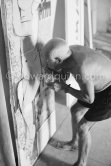 Pablo Picasso fixing the charcoal in the painting "Femme nue allongé [Grand nu allongé]". Nice, Studios de la Victorine 1955. - Photo by Edward Quinn