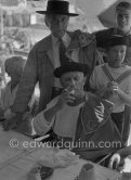 At the lunch given for his friends by Pablo Picasso at restaurant Le Vallauris before the bullfight, Pablo Picasso and Cocteau dress up as toreadors for their friends. Behind them the sons of the writer José Herrera-Petere. Vallauris 1955. - Photo by Edward Quinn
