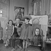 Pablo Picasso with Claude Picasso in "swashbuckler" ("cap et épée") dress. Paloma Picasso with doll. La Californie, Cannes, Christmas 1955. - Photo by Edward Quinn