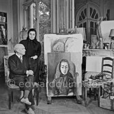 Pablo Picasso and Jacqueline with the painting "Portrait de Jacqueline au rocking-chair et à la mantille noire". La Californie, Cannes 1955. - Photo by Edward Quinn