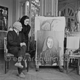 Pablo Picasso and Jacqueline with the painting "Portrait de Jacqueline au rocking-chair et à la mantille noire". La Californie, Cannes 1955. - Photo by Edward Quinn