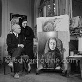 Pablo Picasso and Jacqueline with the painting "Portrait de Jacqueline au rocking-chair et à la mantille noire". La Californie, Cannes 1955. - Photo by Edward Quinn