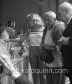 Pablo Picasso and Maya at the "Exposition Internationale Céramique". On the right Manuel Gonzalez Marti, director of the Museo de Bellas Artes de Valencia. Cannes 1955. - Photo by Edward Quinn