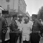 Pablo Picasso with policemen before the corrida put on in his honor. Vallauris 1955. - Photo by Edward Quinn