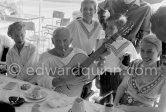 Local Corrida. Restaurant Le Vallauris. Pablo Picasso with guitar. Francine Weisweiller, right Dr. Jeanne Creff (acupuncturist of Pablo Picasso). Vallauris 1955. - Photo by Edward Quinn