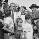 At Pablo Picasso's arrival on the village square where the corrida is to be held the band blares out some of his favourite Spanish melodies. From left Jean Cocteau, Jacques-Henri Lartigue, Pablo Picasso, Jacqueline, Maya Picasso and in front Paloma Picasso and Claude Picasso. Vallauris 1955. - Photo by Edward Quinn