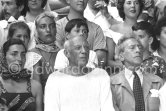 On the grandstand of a bullfight put on in Pablo Picasso's honor. On the left of Pablo Picasso Jacqueline, on the right Jean Cocteau, Inès Sassier, Pablo Picasso's housekeeper, behind Pablo Picasso his children Paloma Picasso, Maya Picasso and Claude Picasso. Vallauris 1955. - Photo by Edward Quinn