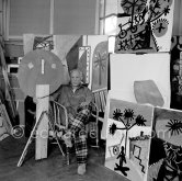 Pablo Picasso with wooden sculpture "L’enfant". La Californie, Cannes 1956. - Photo by Edward Quinn