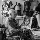 Pablo Picasso and Jacqueline. Luncheon at the dining and work table. Jacqueline is wearing a dress with printed motifs of a Pablo Picasso work. La Californie 1956. see also color Pic560483 and 560482 - Photo by Edward Quinn