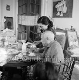 Pablo Picasso and Jacqueline. Luncheon at the dining and work table. La Californie, Cannes 1956. - Photo by Edward Quinn