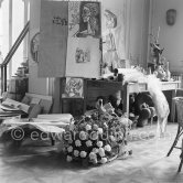 On the day of Pablo Picasso's 75th birthday with flowers he received, some with the Spanish colors. La Californie, Cannes 1956. - Photo by Edward Quinn