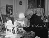 Pablo Picasso working on two plasters of "Centaure". La Californie, Cannes 1956. - Photo by Edward Quinn