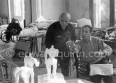 Pablo Picasso and French painter and writer André Verdet, examinig two plasters of "Centaure". Jaime Sabartés in the background. La Californie, Cannes 1956. - Photo by Edward Quinn