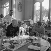 Pablo Picasso and French painter and writer André Verdet, examinig two plasters of "Centaure". Jean Ramié in the background. La Californie, Cannes 1956. - Photo by Edward Quinn