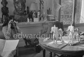Jacqueline taking photos of "Centaure" sculptures. La Californie, Cannes 1956. - Photo by Edward Quinn