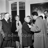 Pablo Picasso interviewed for radio at a private viewing of his book illustrations. With Jean Cocteau, Maurice Thorez, Louis Aragon. Exposition "Pablo Picasso. Un Demi-Siècle de Livres Illustrés". Galerie H. Matarasso. 21.12.1956-31.1.1957. Nice 1956. - Photo by Edward Quinn