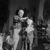 Pablo Picasso with Claude Picasso dressed up as a clown. With goat Esmeralda. La Californie, Cannes 1956. - Photo by Edward Quinn