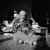 Pablo Picasso with the goat Esmeralda at Christmas 1956. She was a Christmas present from Jacqueline. La Californie, Cannes 1956. - Photo by Edward Quinn