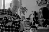 Pablo Picasso and Claude Picasso at Christmas. La Californie, Cannes 1956. - Photo by Edward Quinn