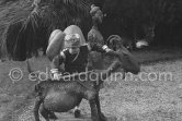Paloma Picasso climbing on the sculpture "La chèvre". Paloma Picasso is wearing the Davy Crockett trapper outfit she received as a Christmas present. La Californie, Cannes 1956. - Photo by Edward Quinn