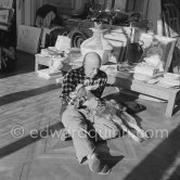 Pablo Picasso with the goat Esmeralda at Christmas 1956. She was a Christmas present from Jacqueline. La Californie, Cannes 1956. - Photo by Edward Quinn