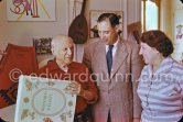 Pablo Picasso with a book about Bernard Palissy, French potter of the 16th century. Pierre-André and Lucie Weill. La Californie, Cannes 1957. - Photo by Edward Quinn
