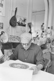 Pablo Picasso and Jacqueline viewing a book about Bernard Palissy, French potter of the 16th century. La Californie, Cannes 1957. - Photo by Edward Quinn