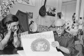 Pablo Picasso and Jacqueline viewing a book about Bernard Palissy, French potter of the 16th century. La Californie, Cannes 1957. - Photo by Edward Quinn