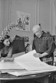 Pablo Picasso and Jacqueline viewing a book about Bernard Palissy, French potter of the 16th century. La Californie, Cannes 1957. - Photo by Edward Quinn