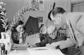 Pierre-André Weill, Pablo Picasso and Jacqueline viewing a book about Bernard Palissy, French potter of the 16th century. La Californie, Cannes 1957. - Photo by Edward Quinn