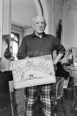 Pablo Picasso with bullfight painting by Claude Picasso. La Californie, Cannes 1957. - Photo by Edward Quinn