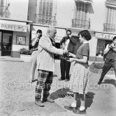 Pablo Picasso signing autograph for a young admirer. La Croisette, Cannes 1957. - Photo by Edward Quinn