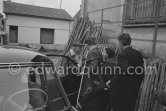 Pablo Picasso, his chauffeur Jeannot and Paulo Picasso arriving for unveiling of mural "The Fall of Icarus" for the conference hall of UNESCO building in Paris. The mural is made up of forty wooden panels. Initially titled "The Forces of Life and the Spirit Triumphing over Evil", the composition was renamed in 1958 by George Salles, who preferred the current title, "The Fall of Icarus". Vallauris, 29 March 1958. - Photo by Edward Quinn