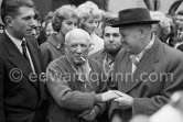 Pablo Picasso, Paulo Picasso, Maurice Thorez. Unveiling of mural "The Fall of Icarus" ("La chute d'Icare") for the conference hall of UNESCO building in Paris. The mural is made up of forty wooden panels. Initially titled "The Forces of Life and the Spirit Triumphing over Evil", the composition was renamed in 1958 by George Salles, who preferred the current title, "The Fall of Icarus" ("La chute d'Icare"). Vallauris, 29 March 1958. - Photo by Edward Quinn