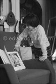 Paloma Picasso with a book on the armchair. La Californie, Cannes 1959. - Photo by Edward Quinn