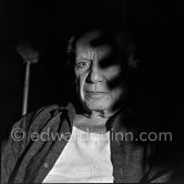 Pablo Picasso in the rocking-chair with a special lighting. La Californie, Cannes 1959. - Photo by Edward Quinn