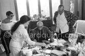 Jacqueline, Theodor "Teto" Ahrenberg, Swedish collector, and his wife Ulla. Pablo Picasso signing a photo by Edward Quinn. La Californie, Cannes 25.10.1959. - Photo by Edward Quinn