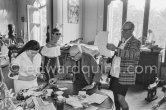 Jacqueline, Theodor "Teto" Ahrenberg, Swedish collector, and his wife Ulla. Pablo Picasso signing a photo by Edward Quinn. La Californie, Cannes 25.10.1959. - Photo by Edward Quinn