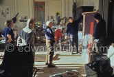 Pablo Picasso, Michel Leiris and Louise Leiris, Pierre Baudouin and Paulo Picasso with tapestry "Les clowns à la lune bleue", La Californie, Cannes 1959. - Photo by Edward Quinn
