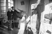 Pablo Picasso with a Spanish wicker mask of a bull, originally intended for bullfighters' training, takes a lesson in bull fighting from an expert, the matador Luis Miguel Dominguin. La Californie, Cannes 1959. - Photo by Edward Quinn