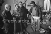 Typical visitorsday at La Californie. Picassolooks at the first copy ofa deluxe edition of a bookof poems by Pierre Reverdy,for which he has made theillustrations. Gathered aroundhim as he comments on thebook are from left LouiseLeiris, owner of the Leiris Gallery Paris, Picasso's son Paulo and the artist Pierre Baudouin. La Californie, Cannes 1959. - Photo by Edward Quinn