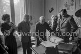 Pablo Picasso shows the first copy of a deluxe edition of a book of poems by Pierre Reverdy, for which he has made the illustrations. Gathered around him as he comments on the book are Lucie Weill, the writer Michel Leiris, his wife Louise Leiris, owner with Daniel-Henry Kahnweiler of the Leiris Gallery Paris, a Paris publisher and André Weill, publisher of some deluxe editions of Pablo Picasso's work. La Californie, Cannes 1959. - Photo by Edward Quinn