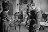 Pablo Picasso shows the first copy of a deluxe edition of a book of poems by Pierre Reverdy, for which he has made the illustrations. With Lucie Weill, wife of André Weill, publisher of some deluxe editions of Pablo Picasso's work. La Californie, Cannes 1959. - Photo by Edward Quinn