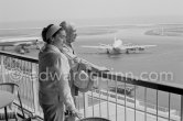 From a terrace at Nice Airport Pablo Picasso and Jacqueline watch for the arrival of the Leiris and the Lascaux from Paris. Nice Airport 1960. - Photo by Edward Quinn