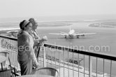 From a terrace at Nice Airport Pablo Picasso and Jacqueline watch for the arrival of the Leiris and the Lascaux from Paris. Nice Airport 1960. - Photo by Edward Quinn