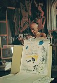 Pablo Picasso showing his original lithograph for the poster announcing his 1960. show in Nice. La Californie, Cannes 1960. - Photo by Edward Quinn