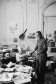 In a corner of his villa Pablo Picasso and David Douglas Duncan. On the table a pile of english newspapers reporting on his London exhibition. La Californie, Cannes 1960. - Photo by Edward Quinn