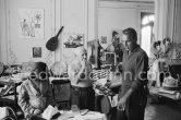 Pablo Picasso, David Douglas Duncan and Paloma Picasso. On the table a pile of English newspapers reporting on his London exhibition. La Californie, Cannes 1960. - Photo by Edward Quinn
