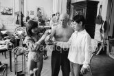 Pablo Picasso introduces Claude Picasso and Paloma Picasso to a new pet, a talking parrot, which is squatting on his arm. La Californie, Cannes 1960. - Photo by Edward Quinn
